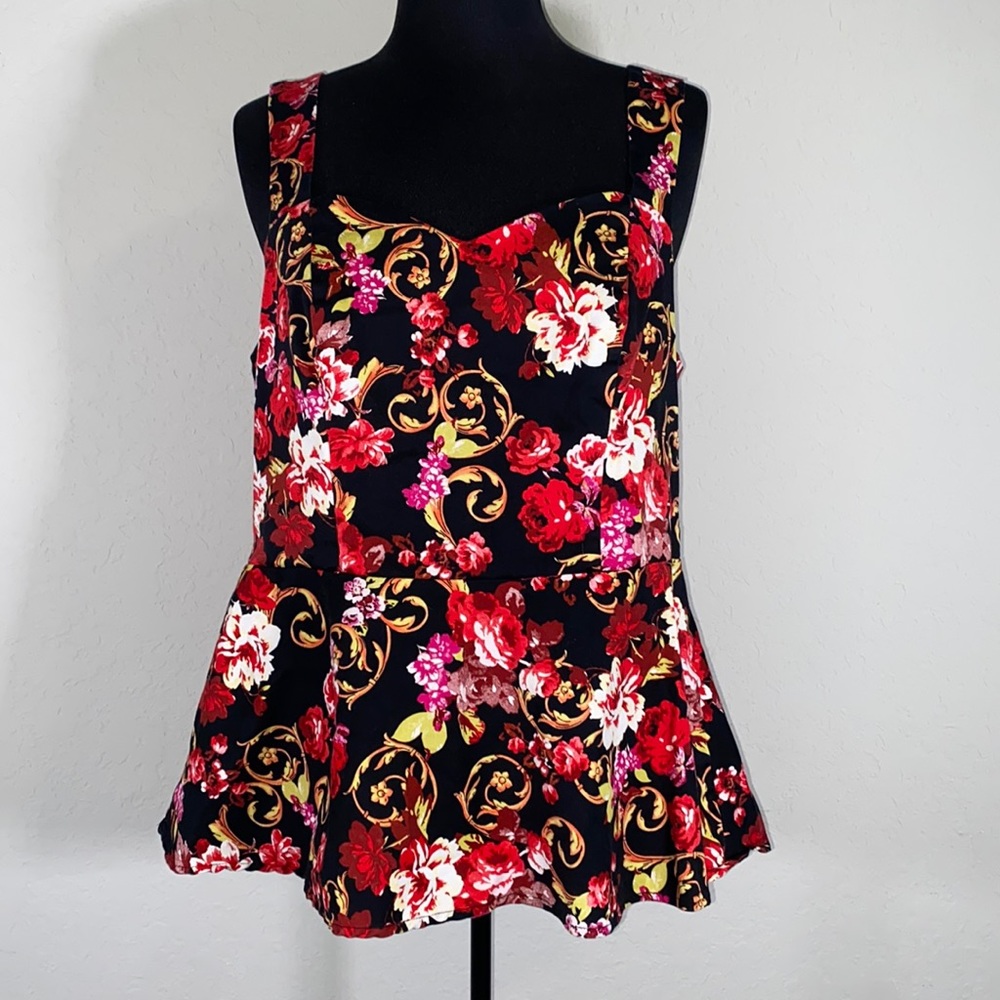 Torrid peplum sleeveless top with cutout on the back